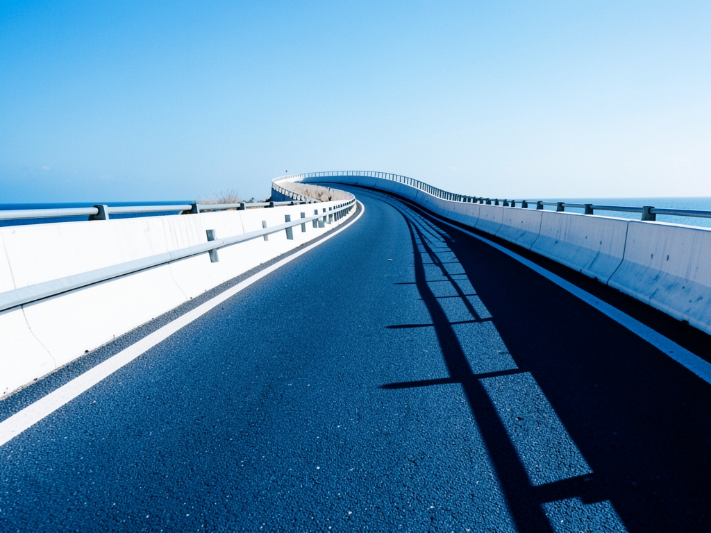 sun bleached coastal highway winding into infinite curve with