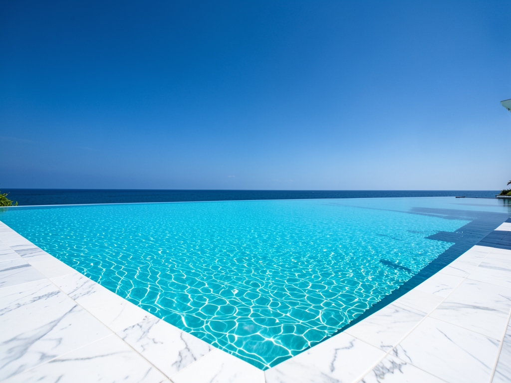 Endless turquoise infinity pool merging seamlessly with cloudless