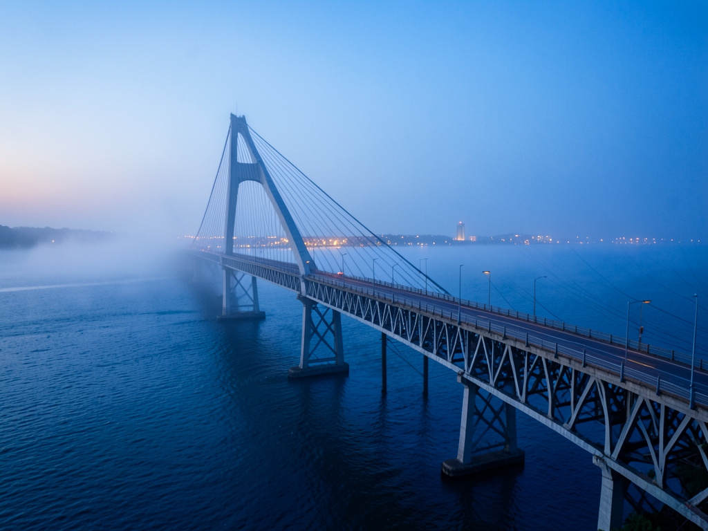 misty twilight settles over Chesapeake bridge tunnel where steel