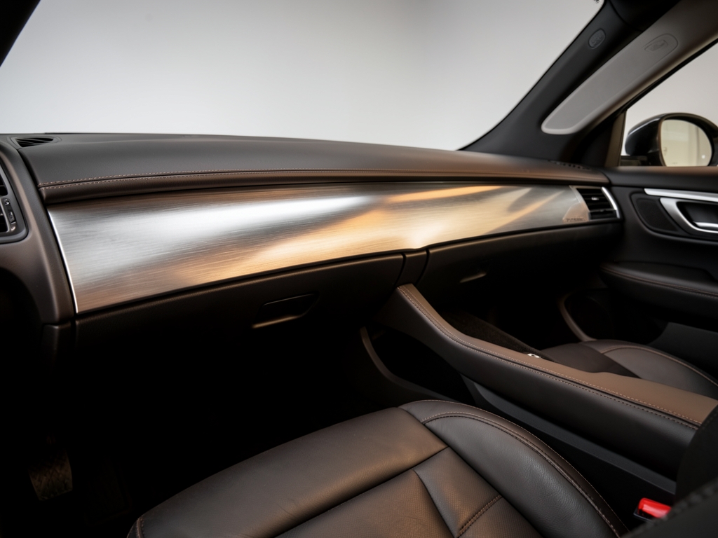 Sleek automotive studio interior with curved dashboard form