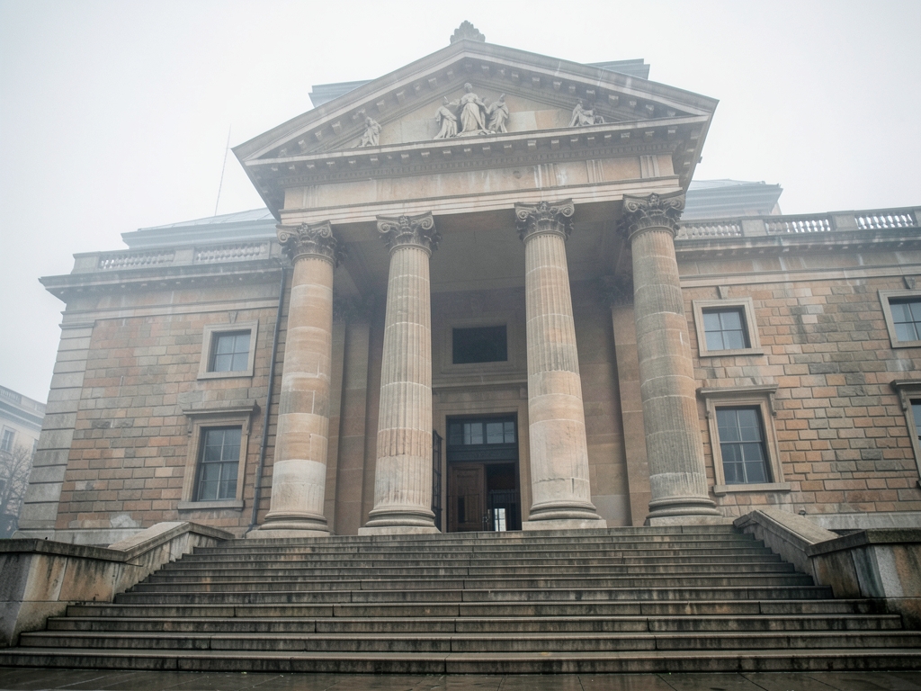 Grand stone civic building with tall columns wide