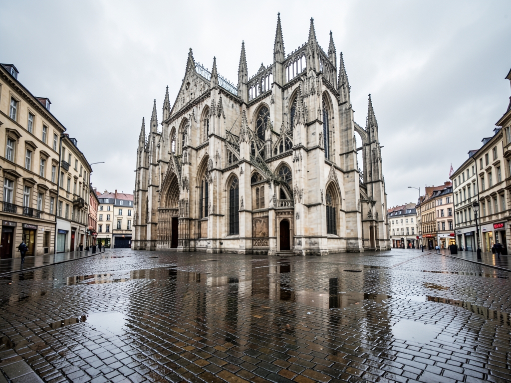 wide angle view crumbling European cathedral square under overcast