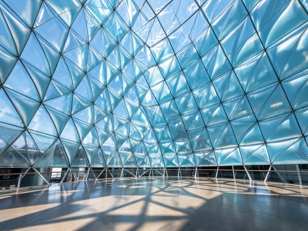 Sunlight filters through translucent parametric facade layered ETFE