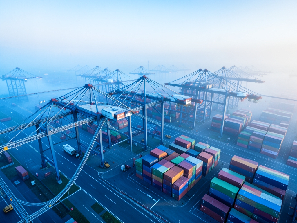 Aerial view modern logistics dawn cranes conveyor bridges