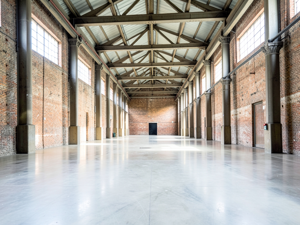 vast pristine warehouse interior with towering