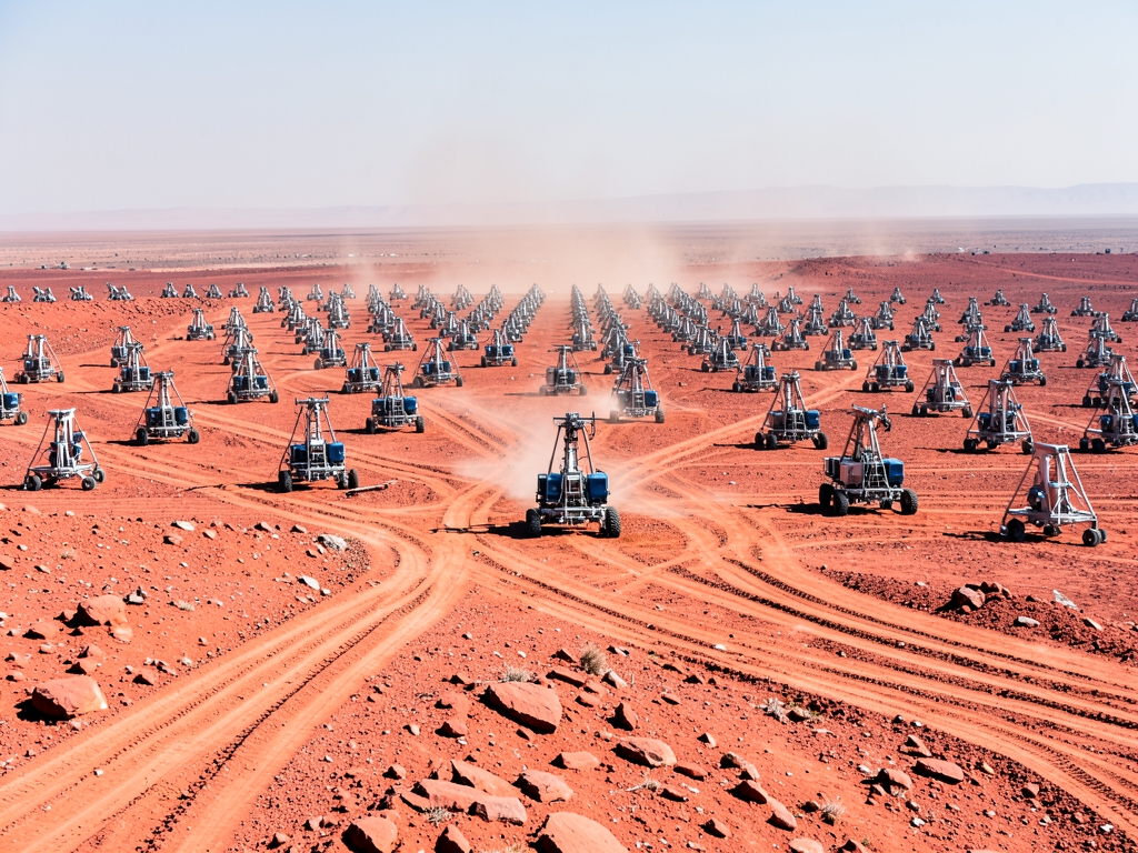 Expansive arid plateau with dense grid small drill