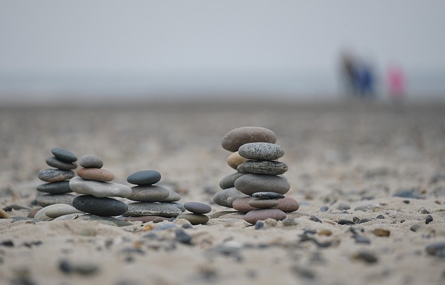 beach stones pebbles sand balance sea stacked pile coastal nature