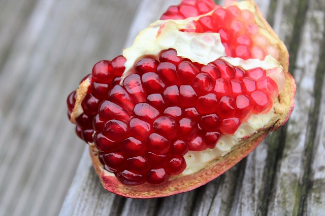 pomegranate exotic fruits fruits cut sliced open seeds nature vitamins red garnet fruit to reduce pomegranate pomegranate pom