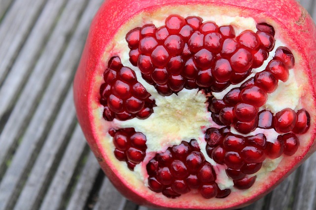 pomegranate exotic fruits fruits cut sliced open seeds nature vitamins red garnet fruit to reduce pomegranate pomegranate pom