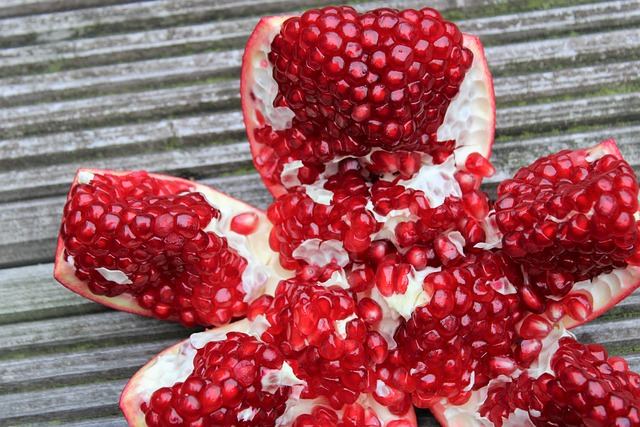 pomegranate exotic fruits fruits cut sliced open seeds nature vitamins red garnet fruit to reduce pomegranate pomegranate pom