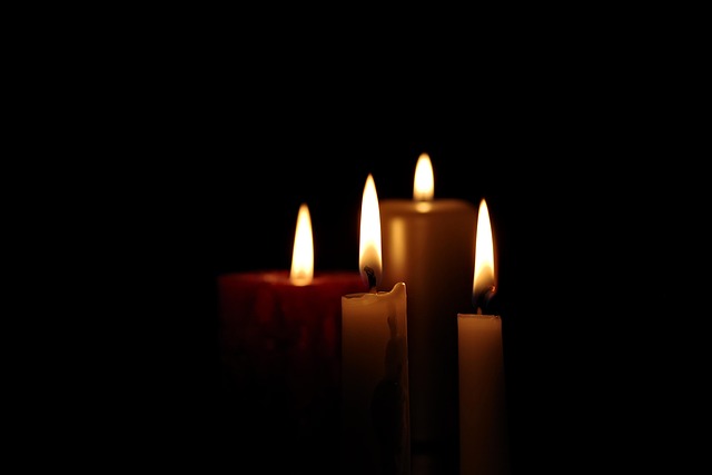 a candle candle light all souls day memory grave all the saints bereavement tombstone dead autumn all souls religion cemetery