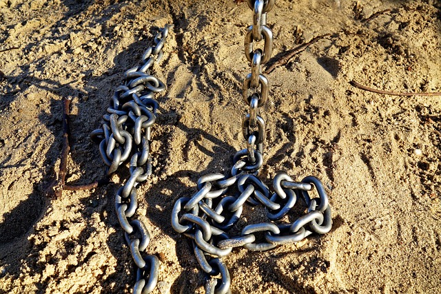 chain link connection attachment security steel strength strong sand chain in the sand brown security