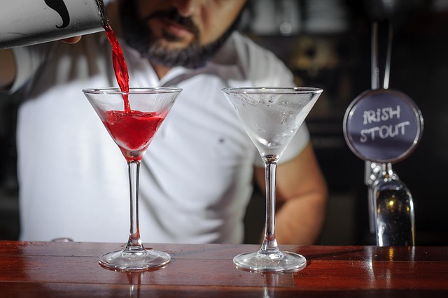 bartender bar glass martini juice cocktail shaker pours preparation red drink table bar counter two capacity serving bartend