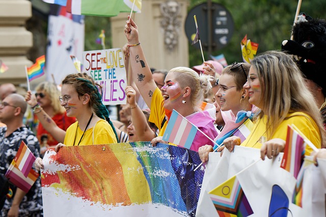 people ladies girls colors flags advocacy event pride parade mark the street urban town community cheerfulness exuberance cl