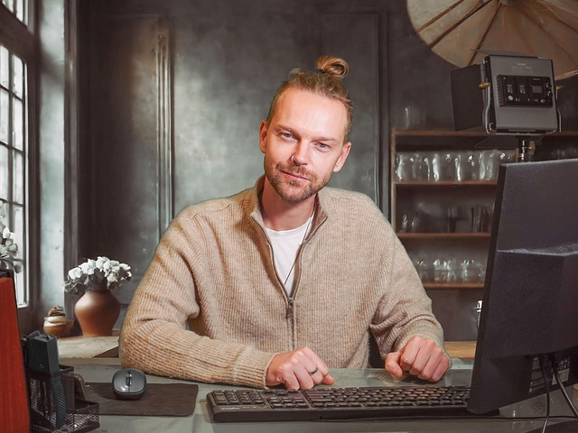 man desk computer adult blond pc desktop studio study studying learning typing working office work business online technolo