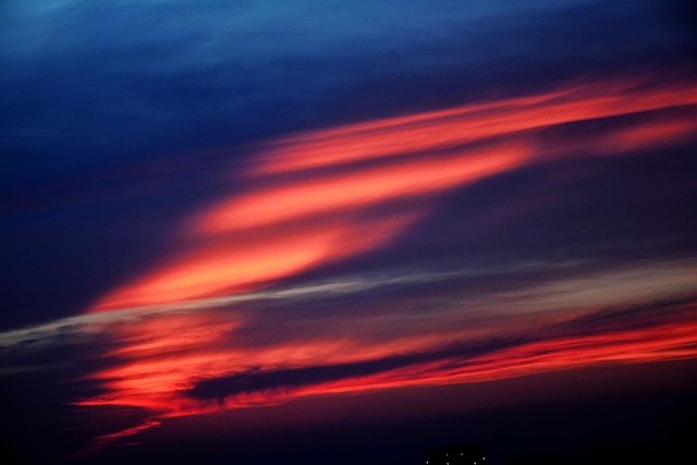 sun sunset sky clouds view nature red light behind the clouds light filtering cloudy horizon color stunning color belt stunni