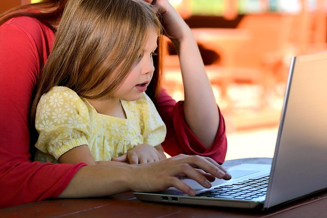 child girl young caucasian childhood daughter computer learning parent mother family computer computer computer learning lear