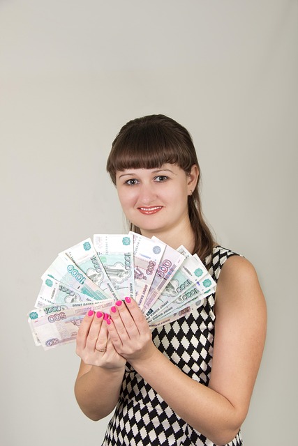 young woman money keeps gain in the hands fan shows happy money money money money money gain