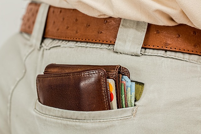 wallet cash pocket credit card money purse leather currency male man belt waistband consumer wealth closeup money money mon