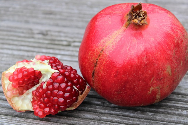 pomegranate exotic fruits fruits cut sliced open seeds nature vitamins red garnet fruit to reduce pomegranate pomegranate pom