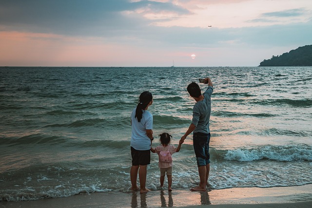 selfie beach family child mother father vacations mobile smartphone photo summer sea water ocean happy to travel people gir