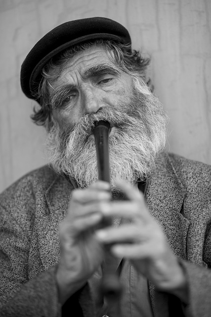 old male beard music kaval flute loneliness tired eyelash face looks documentary master silent man sad desperate street vi