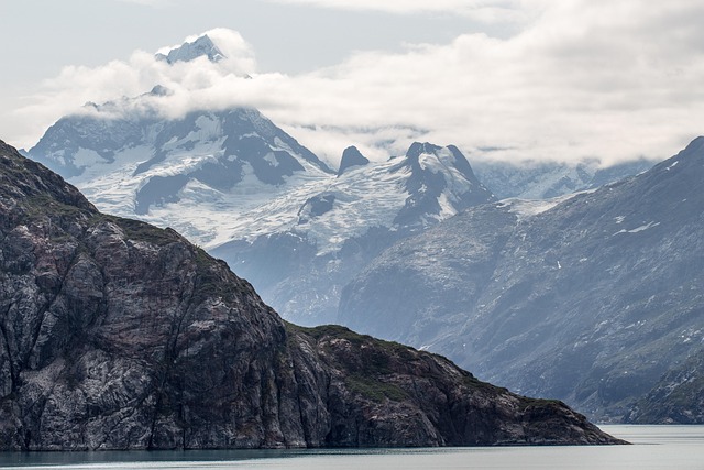 mountain peak glacier alaska landscape scenery nature summit sky scenic snow outdoor adventure rock cliff alaska alaska ala