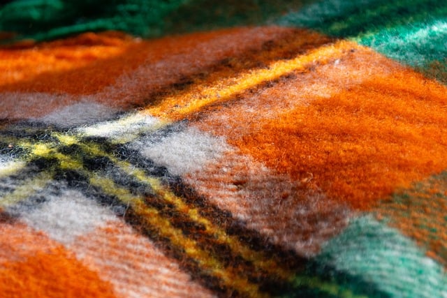 wool texture colorful blanket warm striped orange brown green close up soft cozy vibrant pattern cosiness warmth throw wint