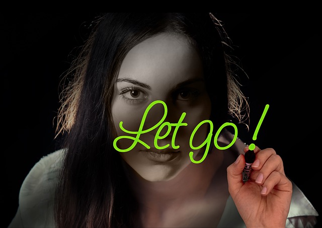 woman face head hand write glass word let go submit freedom cancel to let reveal to let yourself fall despair let drive let