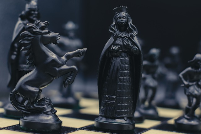 chess black chess pieces fantasy chess strategy game queen chess piece knight horse piece battle of minds board game dramatic light