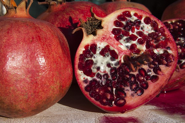 pomegranate red fruit cut open yummy healthy vitamins punica granatum food meal kernels juice drops pomegranate pomegranate p