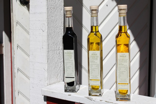 bottles oil vinegar bottle food recipe cork label white yellow dark red salad menu bill of fare restaurant vinegar vinegar