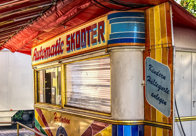 bumper cars box car fair kerwe ride fairground folk festival amusement park leisure time cashbox the ticket booth pay roller shu