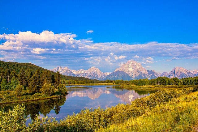 lake mountains grand teton reflection water mountain range scenery scenic nature grand teton national park wyoming usa grand tet