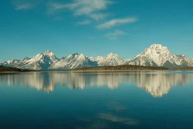 tetons wyoming reflections morning nature jackson lake lake water calm serene landscape mountains grand teton national park usa