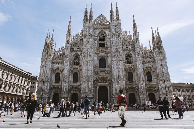 milan cathedral church architecture people facade building historic historical cathedral square landmark tourist attraction duom