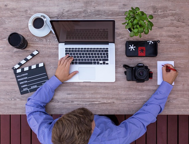 filmmakers youtuber script screenwriter writing storyboard story boarding film producer from above in the workplace lapt