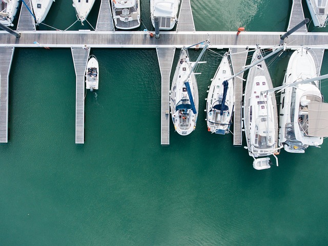 anchored yachts dock marina luxury yachting wharf boatyard travel vessels water boats aerial view bird s eye view nature dron