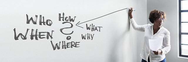 business office training problem solution ask who how what where when why woman lecturer presentation whiteboard board writ